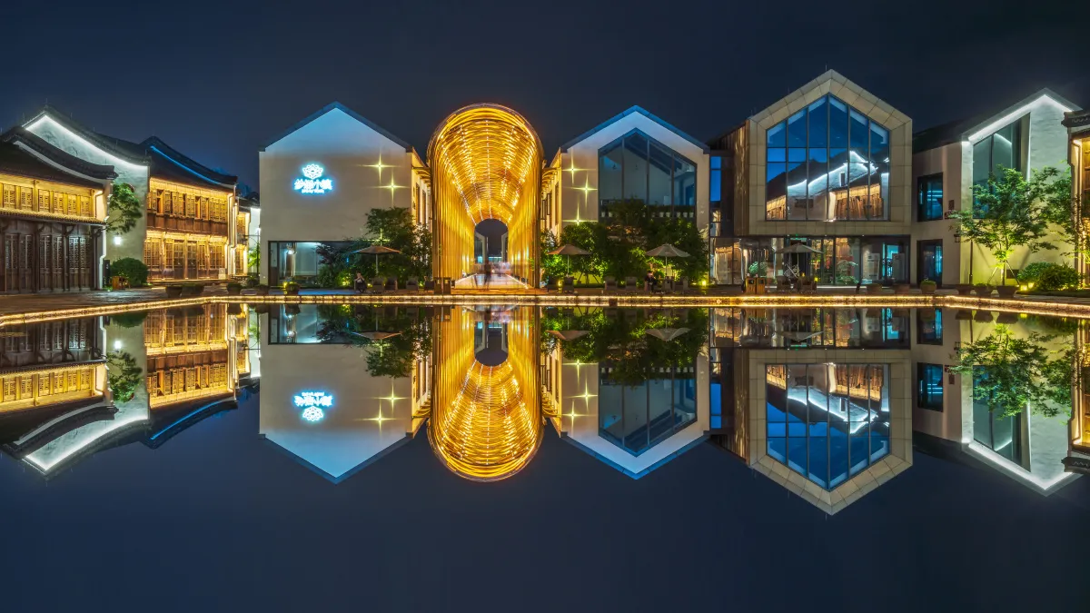 Modern tech workspaces and historic water town buildings in Dream Town, Hangzhou.